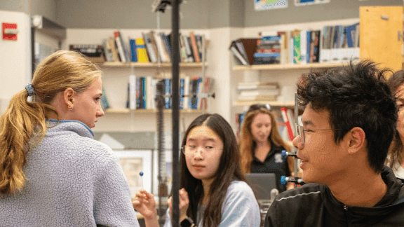 While the commencement of the Academy Building’s renovation has disrupted the weekly assemblies in the Assembly Hall, the all-school gathering is still held — with a twist. Instead of scaling the grooved marble steps through the foyer, students and faculty trek across campus to Love Gym. Generally, the assembly block in Exonians’ schedules entails an address given by a guest speaker. However, due to a Curriculum Committee initiative introduced last spring, this year, the time slot is used more broadly: paired advisory discussions to review AI literacy, class-based activities, and, most recently, various workshops for all grades, excluding seniors. 
